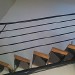 escalier limon central en tube rond.
